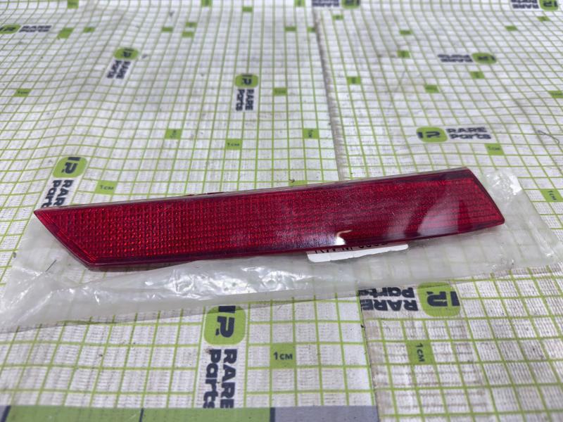 Отражатель в задний бампер левый Mitsubishi Lancer