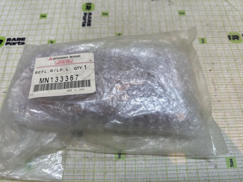 Отражатель в бампер задний левый для Mitsubishi